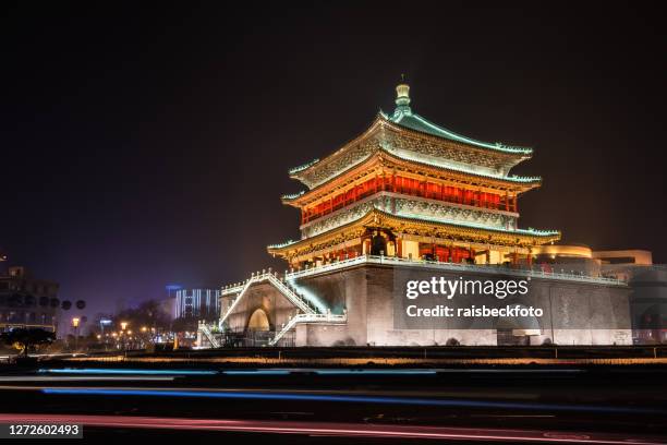 xian bell tower in at night in xian, shaanxi, china - xi'an stock pictures, royalty-free photos & images