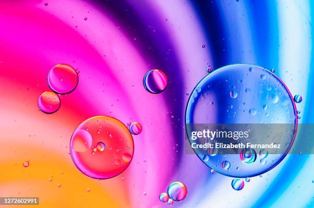 abstract - oil in water with colored background - oil liquid ストックフォトと画像