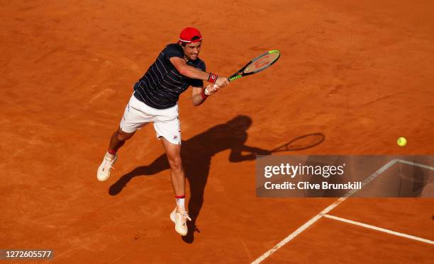 Guido Pella of Argentina plays a backhand in his round one match against Denis Shapovalov of Canada during day two of the Internazionali BNL d'Italia...