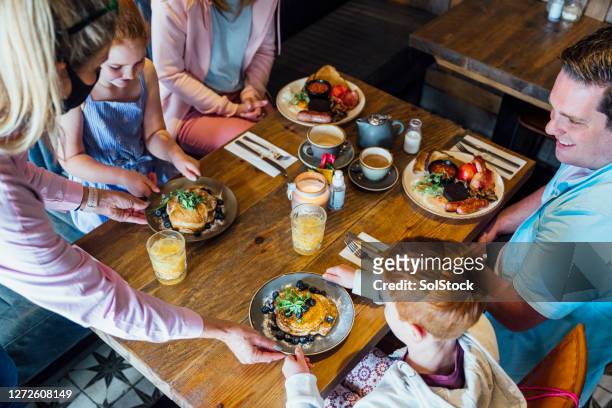 family breakfast time - coronavirus restaurant stock pictures, royalty-free photos & images