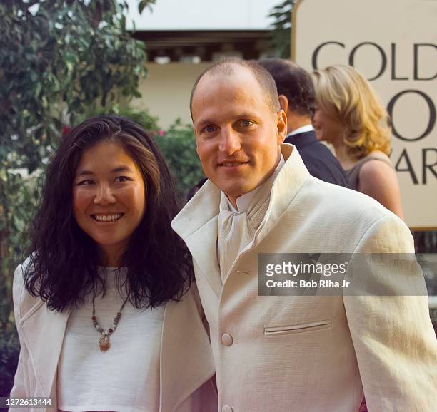 Woody Harrelson and Laura Louie arrive at Golden Globe Awards Show, January 19, 1997 in Beverly Hills, California.