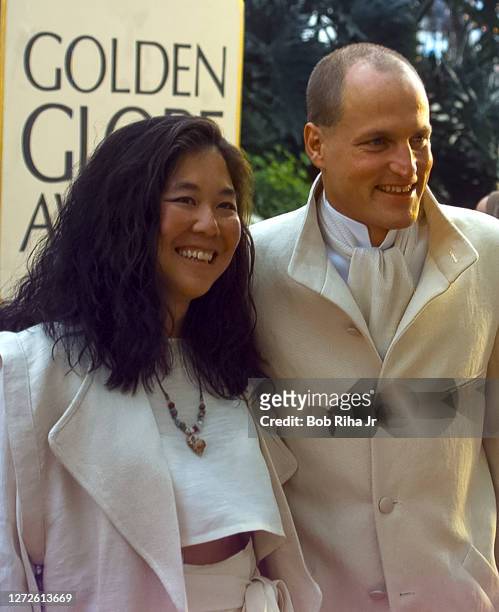 Woody Harrelson and Laura Louie arrive at Golden Globe Awards Show, January 19, 1997 in Beverly Hills, California.