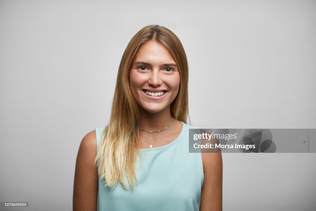 Smiling Female Entrepreneur On White Background