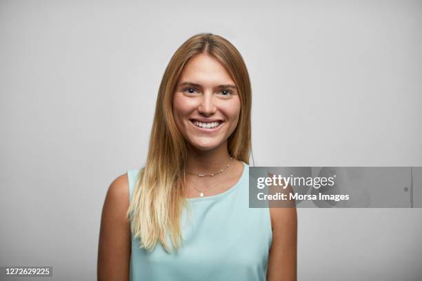 smiling female entrepreneur on white background - blonde hair white background stock pictures, royalty-free photos & images