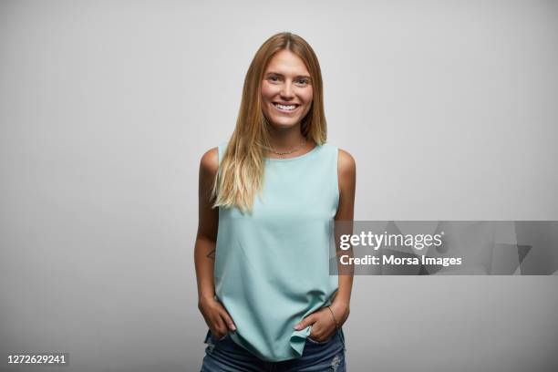 smiling young female business person on white background - portrait close up woman 20 29 stock pictures, royalty-free photos & images