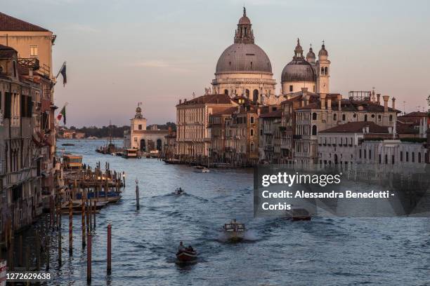 Gondolas, Boat taxis and Ferries sail in the Canale Grande on September 11, 2020 in Venice, Italy. Venice is slowly trying to revamp its tourism...