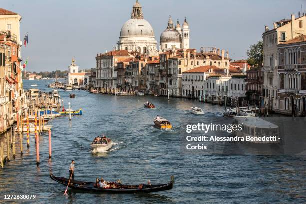 Gondolas, Boat taxis and Ferries sail in the Canale Grande on September 10, 2020 in Venice, Italy. Venice is slowly trying to revamp its tourism...