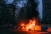 burning street blockade, protesters blocked roads