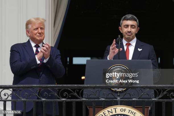 Foreign Affairs Minister of the United Arab Emirates Abdullah bin Zayed bin Sultan Al Nahyan speaks as U.S. President Donald Trump looks on during...