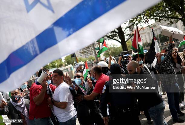 Protesters from multiple Palestinian rights organizations scuffle with a pro-Israel group outside the White House on September 15, 2020 in...