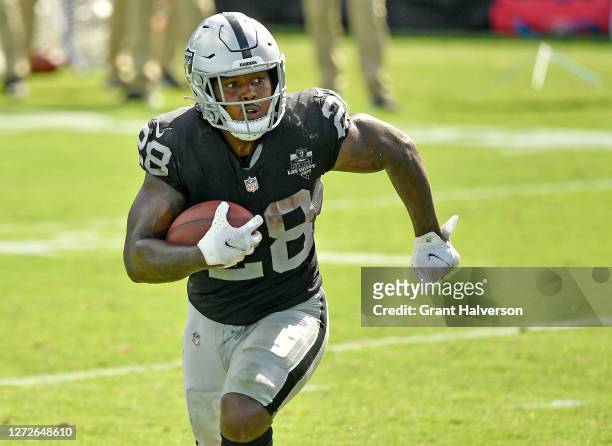 Josh Jacobs of the Las Vegas Raiders runs against the Carolina Panthers during their game at Bank of America Stadium on September 13, 2020 in...