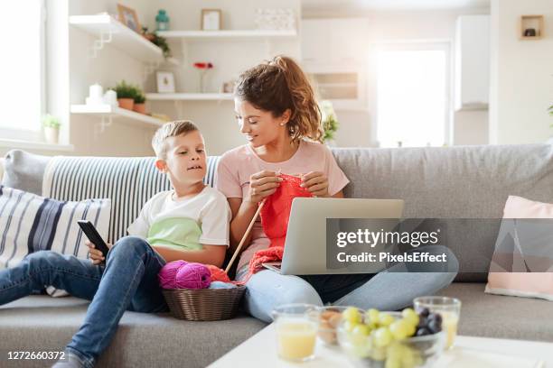 mother and son spend quality time together - crocheting stock pictures, royalty-free photos & images