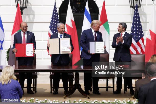 Foreign Affairs Minister of Bahrain Abdullatif bin Rashid Al Zayani, Prime Minister of Israel Benjamin Netanyahu, U.S. President Donald Trump, and...