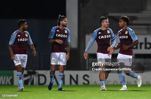 Ollie Watkins of Aston Villa celebrates after scoring his team's first goal with Jack Grealish during the Carabao Cup Second Round match between...