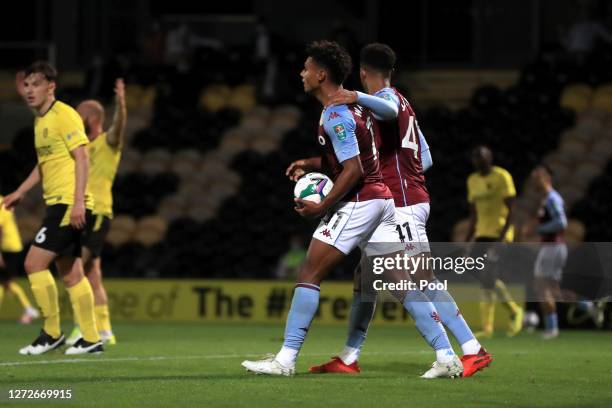 Ollie Watkins of Aston Villa celebrates after scoring his team's first goal during the Carabao Cup Second Round match between Burton Albion and Aston...