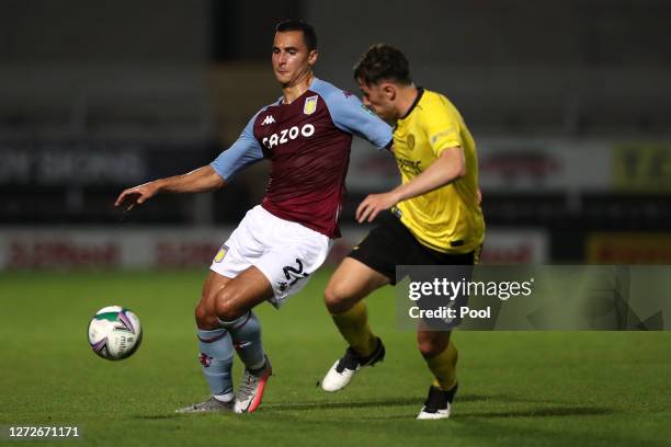 Anwar El Ghazi of Aston Villa battles for possession with Kieran Wallace of Burton Albion during the Carabao Cup Second Round match between Burton...