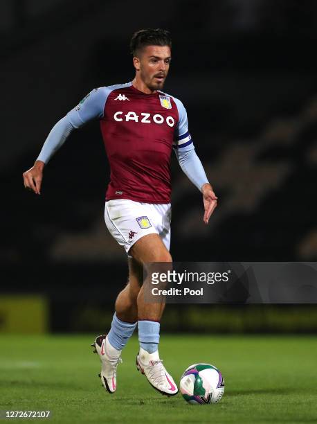 Jack Grealish of Aston Villa runs with the ball during the Carabao Cup Second Round match between Burton Albion and Aston Villa at Pirelli Stadium on...