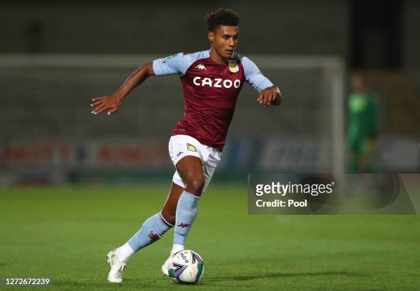Ollie Watkins of Aston Villa runs with the ball during the Carabao Cup Second Round match between Burton Albion and Aston Villa at Pirelli Stadium on...
