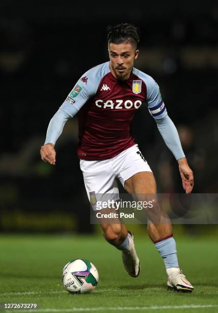 Jack Grealish of Aston Villa runs with the ball during the Carabao Cup Second Round match between Burton Albion and Aston Villa at Pirelli Stadium on...
