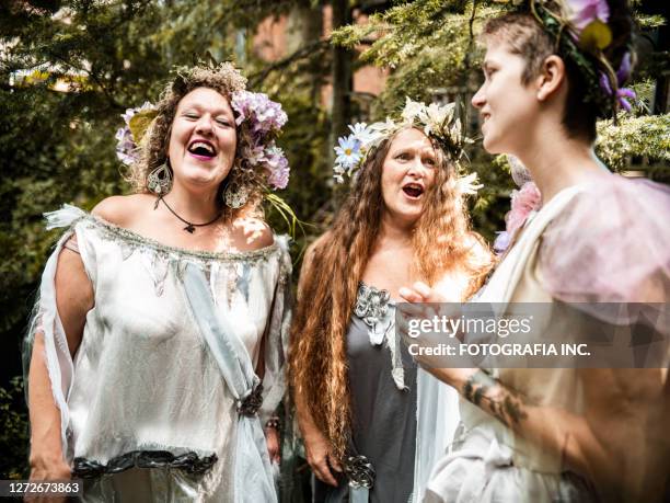 girlfriends singing in the garden - cosplayer stock pictures, royalty-free photos & images
