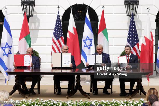 Foreign Affairs Minister of Bahrain Abdullatif bin Rashid Al Zayani, Prime Minister of Israel Benjamin Netanyahu, U.S. President Donald Trump, and...