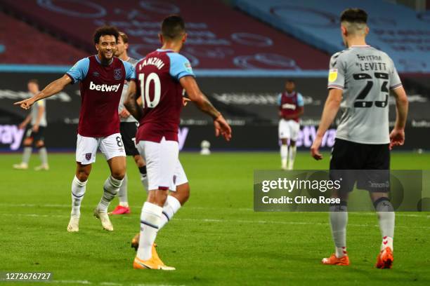 Felipe Anderson of West Ham United celebrates after scoring his team's third goal during the Carabao Cup Second Round Match between West Ham United...