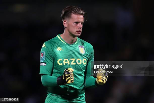 Orjan Nyland of Aston Villa celebrates after his team score their third goal during the Carabao Cup Second Round match between Burton Albion and...