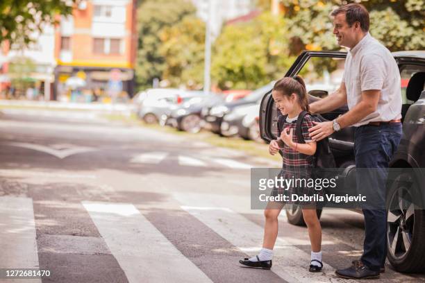 father taking his daughter to school - uniform stock pictures, royalty-free photos & images