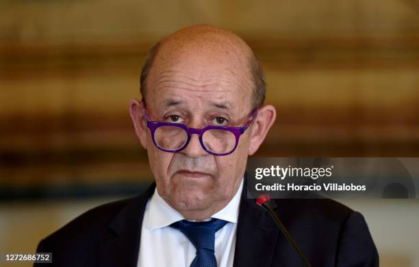 French Foreign Minister Jean-Yves Le Drian delivers a statement with the Portuguese Foreign Minister Augusto Santos Silva at the end of their working...