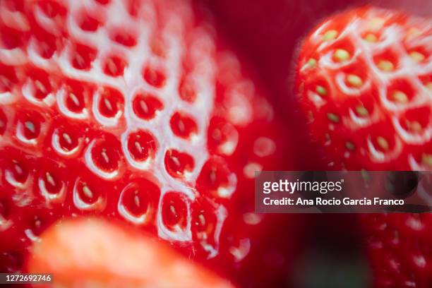 abstract macro background of some organic and fresh strawberries - fruit smoothies stock pictures, royalty-free photos & images