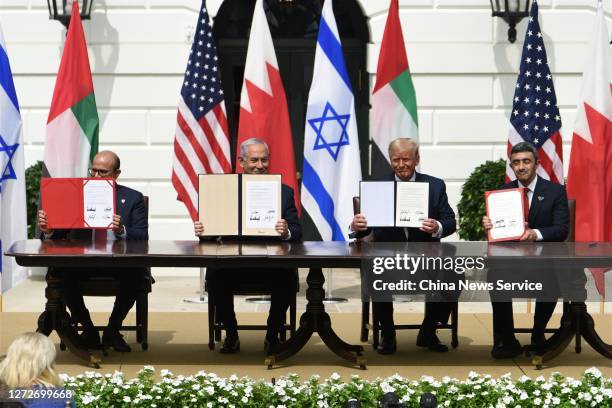 Foreign Affairs Minister of Bahrain Abdullatif bin Rashid Al Zayani, Prime Minister of Israel Benjamin Netanyahu, U.S. President Donald Trump and...