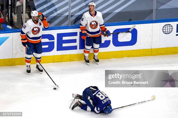 Anthony Beauvillier of the New York Islanders commits a double-minor high-sticking penalty on Mikhail Sergachev of the Tampa Bay Lightning during the...