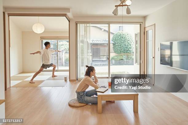 asian couples spend own free time at home. - woman straddling man stock pictures, royalty-free photos & images