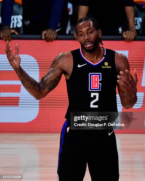 Kawhi Leonard of the LA Clippers of the LA Clippers reacts during the third quarter against the Denver Nuggets in Game Seven of the Western...