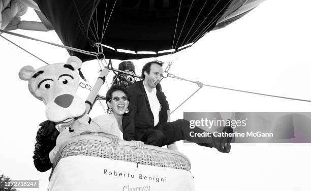 Italian actress Claudia Cardinale and Italian actor Roberto Begnini, at a publicity event for the release of the film "Son of Pink Panther" in 1993...