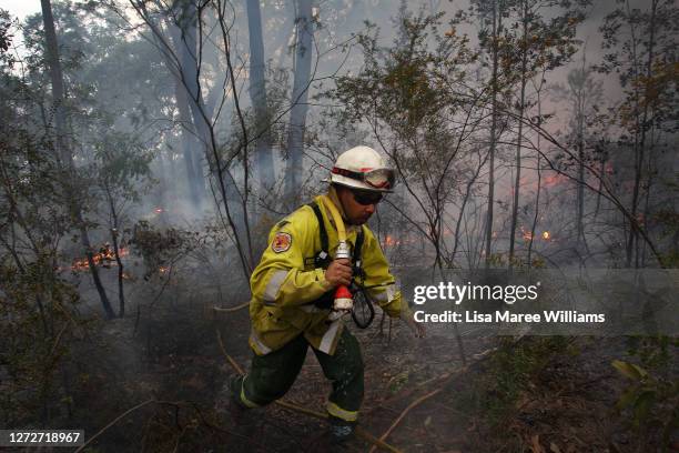 Sonny Cromelin a Field Officer with NSW National Parks and Wildlife Service in Dubbo monitors a hazard reduction burn at Bowen Mountain a known koala...