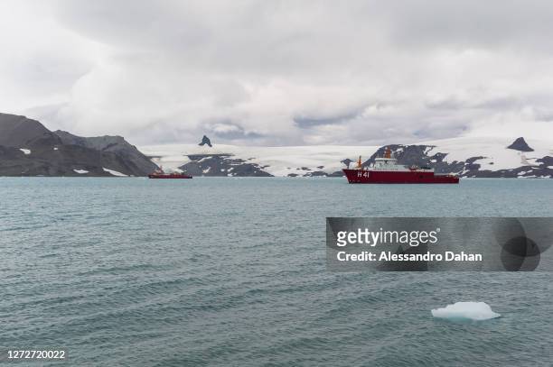 Polar ship Almirante Maximiano at anchor in Almirantado Bay with the Nunatak Needle and Tern in the background, on January 11, 2020 in King George...