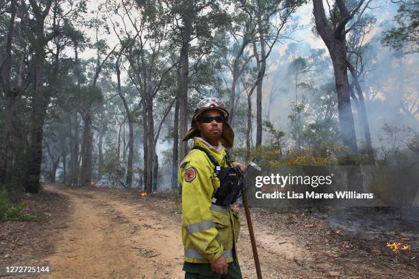 Sonny Cromelin a Field Officer with NSW National Parks and Wildlife Service in Dubbo monitors a hazard reduction burn at Bowen Mountain a known koala...