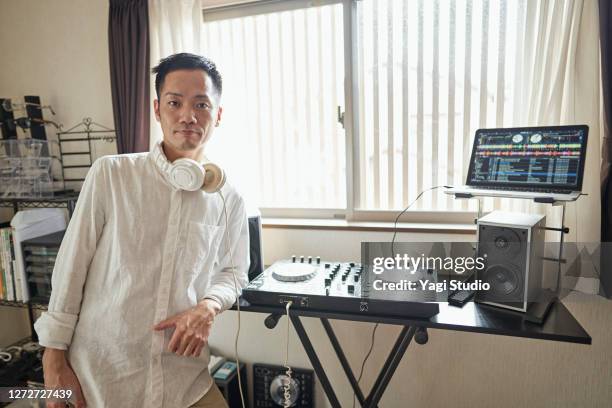 japanese men enjoy djing as a hobby at home - djiang stock pictures, royalty-free photos & images