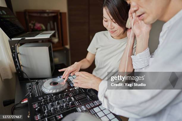 japanse couple  enjoy djing as a hobby at home - djiang stock pictures, royalty-free photos & images