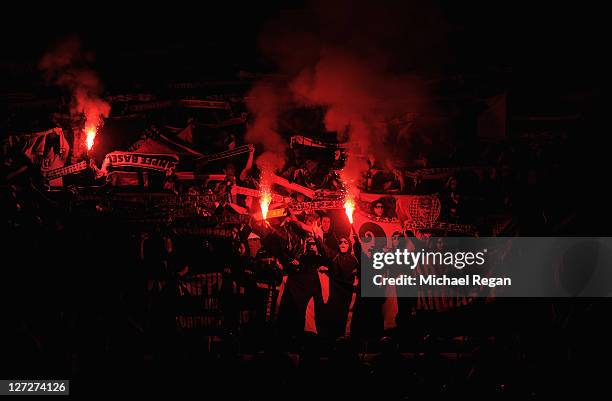 Basel fans light flares in support of their team prior the UEFA Champions League Group C match between Manchester United and FC Basel at Old Trafford...