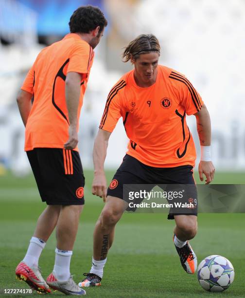 Juan Mata and Fernando Torres of Chelsea during a training session ahead of the UEFA Champions League Group E match between Valencia CF and Chelsea...