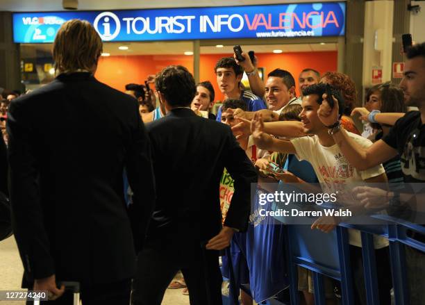 Fernando Torres and Juan Mata of Chelsea are greeted by fans as they arrive ahead of the UEFA Champions League Group E match between Valencia CF and...