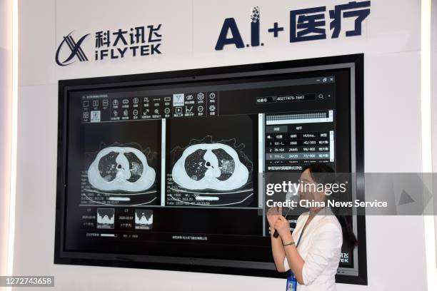 Worker introduces a scan-reading artificial intelligence system at the headquarters of iFLYTEK on September 15, 2020 in Hefei, Anhui Province of...