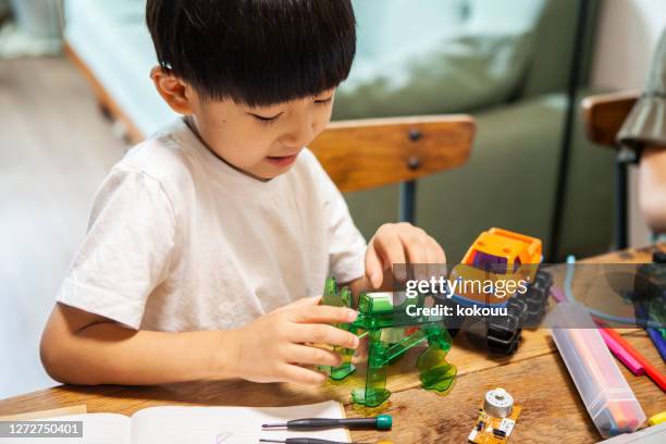 boys are happily doing electronic work - boy playing with cars stock pictures, royalty-free photos & images