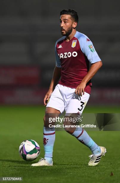 Neil Taylor of Aston Villa runs with the ball during the Carabao Cup Second Round match between Burton Albion and Aston Villa at Pirelli Stadium on...
