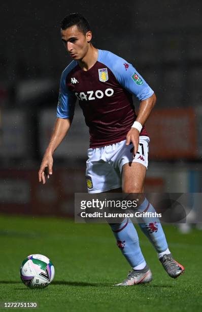 Ahmed Elmohamady of Aston Villa runs with the ball during the Carabao Cup Second Round match between Burton Albion and Aston Villa at Pirelli Stadium...