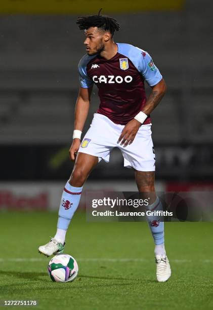 Tyrone Mings of Aston Villa runs with the ball during the Carabao Cup Second Round match between Burton Albion and Aston Villa at Pirelli Stadium on...