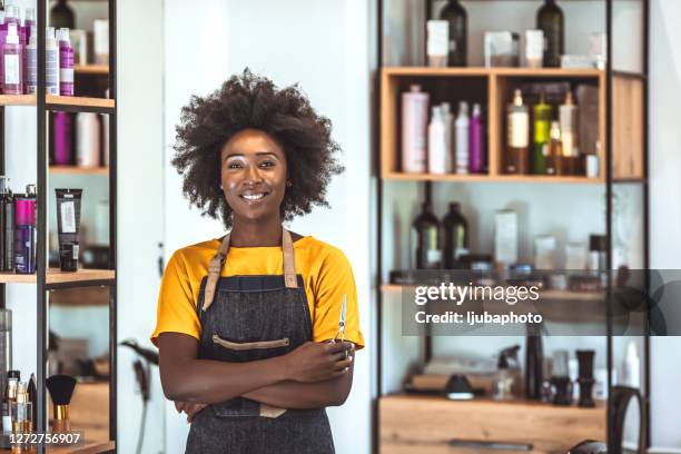 stop by for the hippest haircuts in the city - women barber stock pictures, royalty-free photos & images