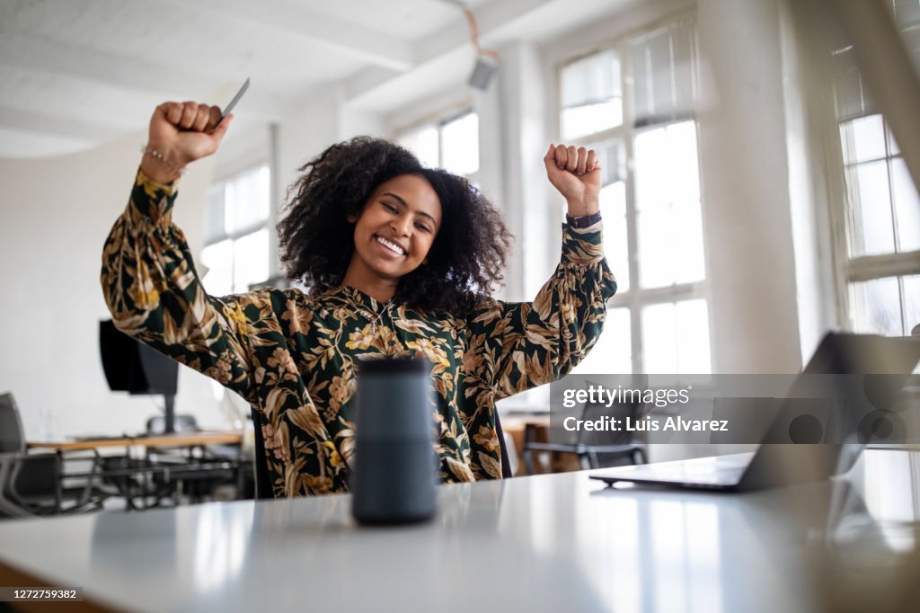Woman feeling excited with online shopping experience